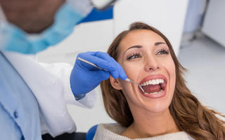 Dentist examining a patient teeth during a dental checkup