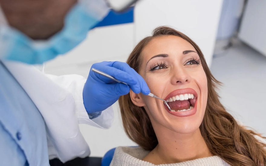 Dentist examining a patient teeth during a dental checkup